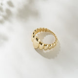 Gold ring on a light background
