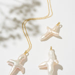 Gold necklace with cross pearl pendant