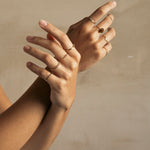 Woman hands with gold filled rings