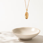 Olivia Necklace featuring a delicate olive branch design, crafted from durable 18kt gold stainless steel. The elegant design symbolizes peace and prosperity, with a luxurious gold finish that adds sophistication to any outfit.