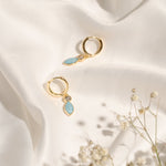 Pair of Christine Earrings showcasing their small hoop shape and colourful enamel finish.