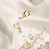 Pair of Christine Earrings showcasing their small hoop shape and colourful enamel finish.