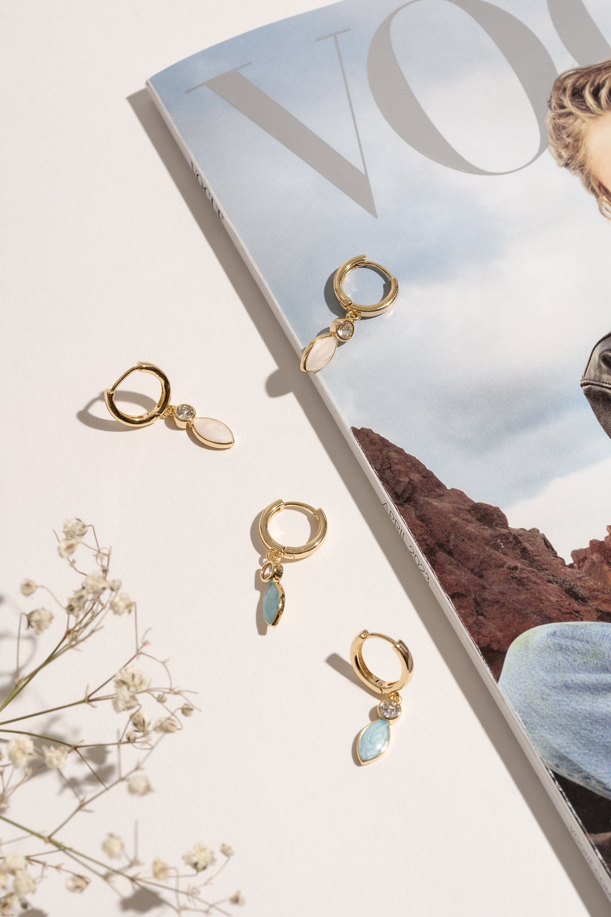 Close-up of the Christine enamel hoops highlighting the blue and white colour combination.