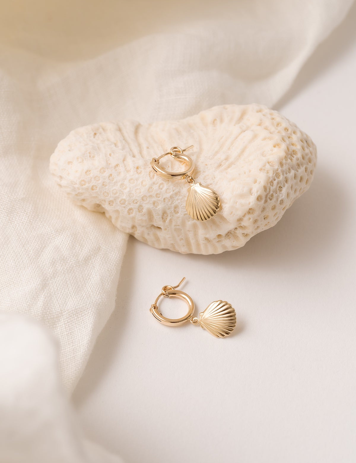 Alana Seashell Necklace with a seashell pendant on a 14kt gold-filled chain.