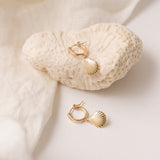 Alana Seashell Necklace with a seashell pendant on a 14kt gold-filled chain.