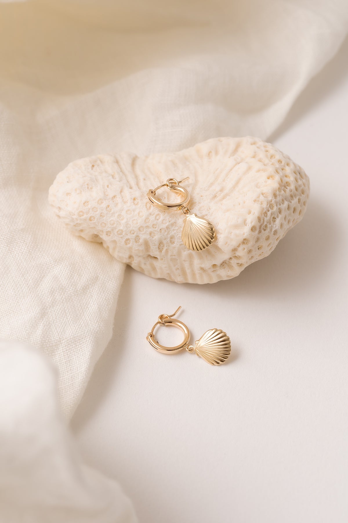 Alana Seashell Necklace with a seashell pendant on a 14kt gold-filled chain.