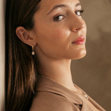 Woman with brown hair model with Gold filled 15mm hoops with pearl necklace