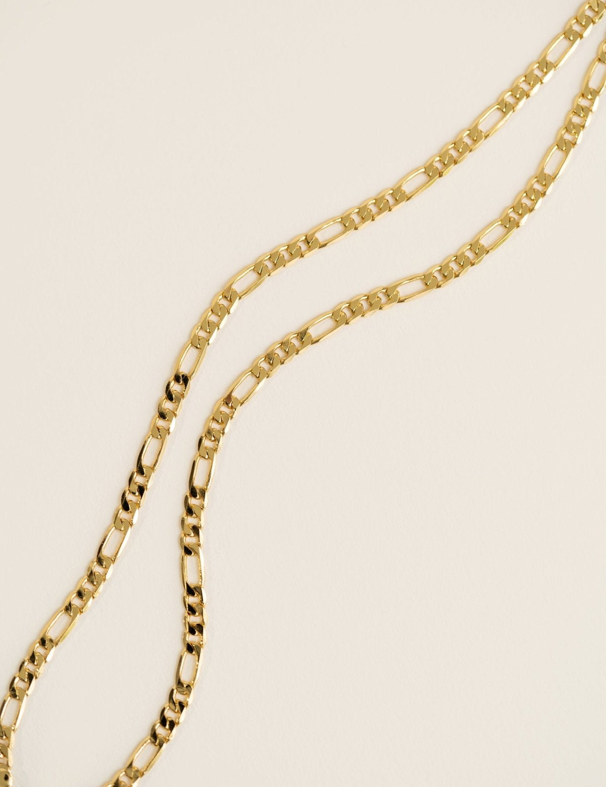 Figaro Necklace featuring a 16-inch chain with a heavy gold-plated finish.
