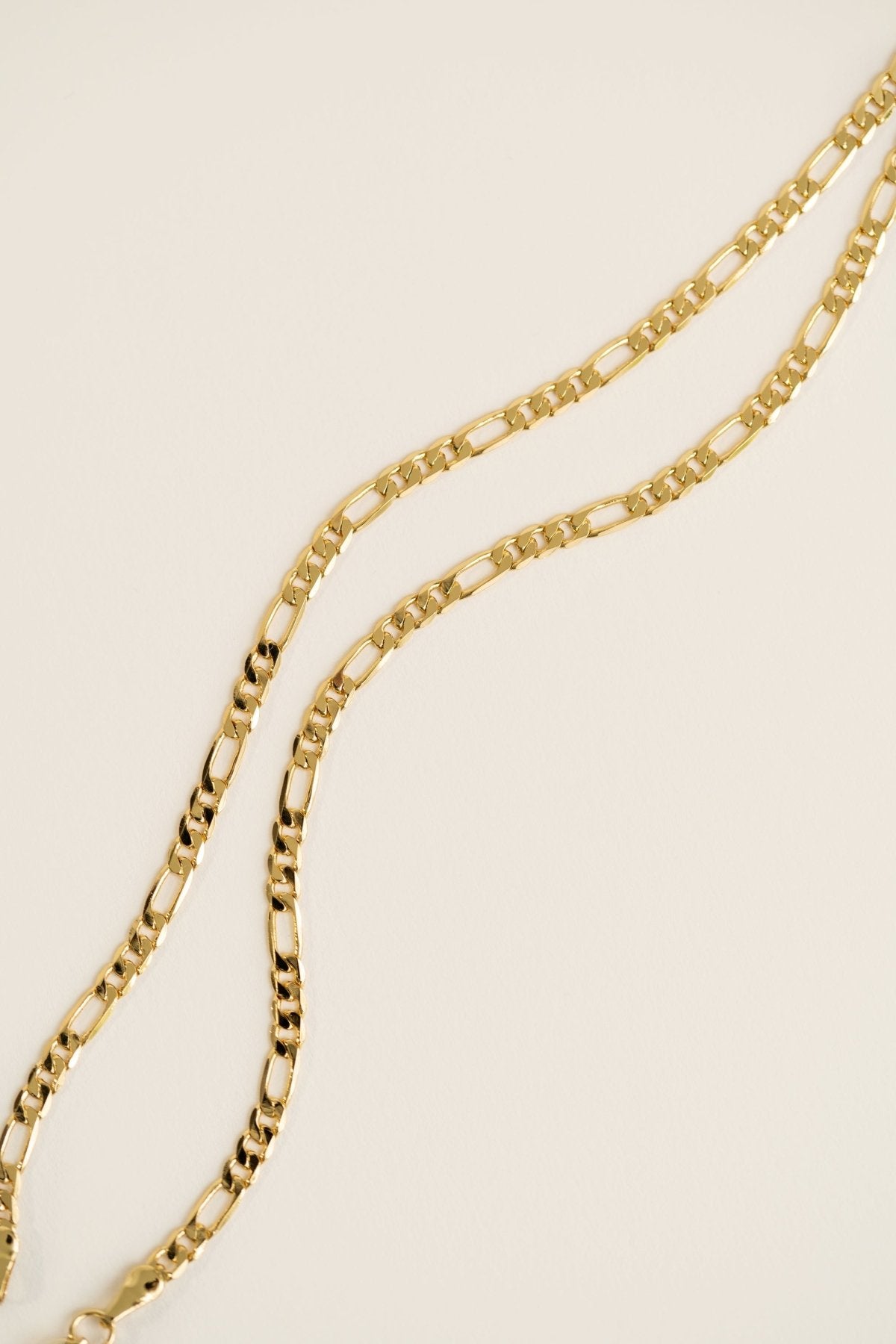 Figaro Necklace featuring a 16-inch chain with a heavy gold-plated finish.